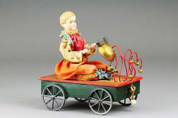 American Mfg. Bisque Head Doll Bell Toy