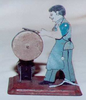 Arnold Toy Man at Wheel Sharpening Scissors 1910 Tin Windup