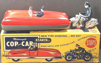 Automatic Toy Co. Motorcycle Cop chasing Car